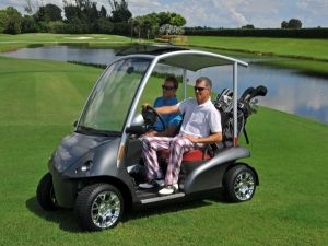 Garia Golf Buggy in grey on golf course by lake